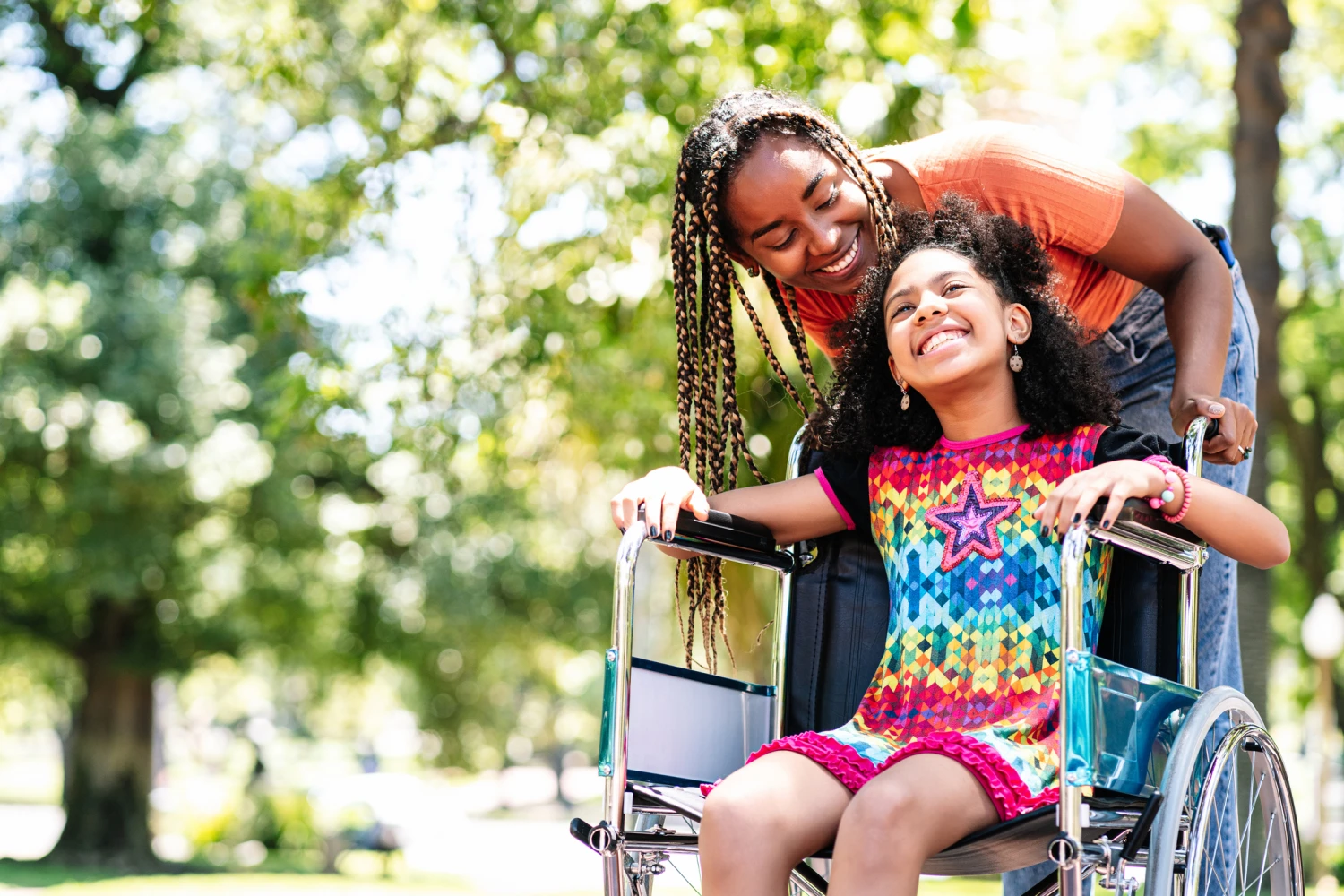 Mother with child in wheelchair discussing Child's NDIS Goals - Focus Care