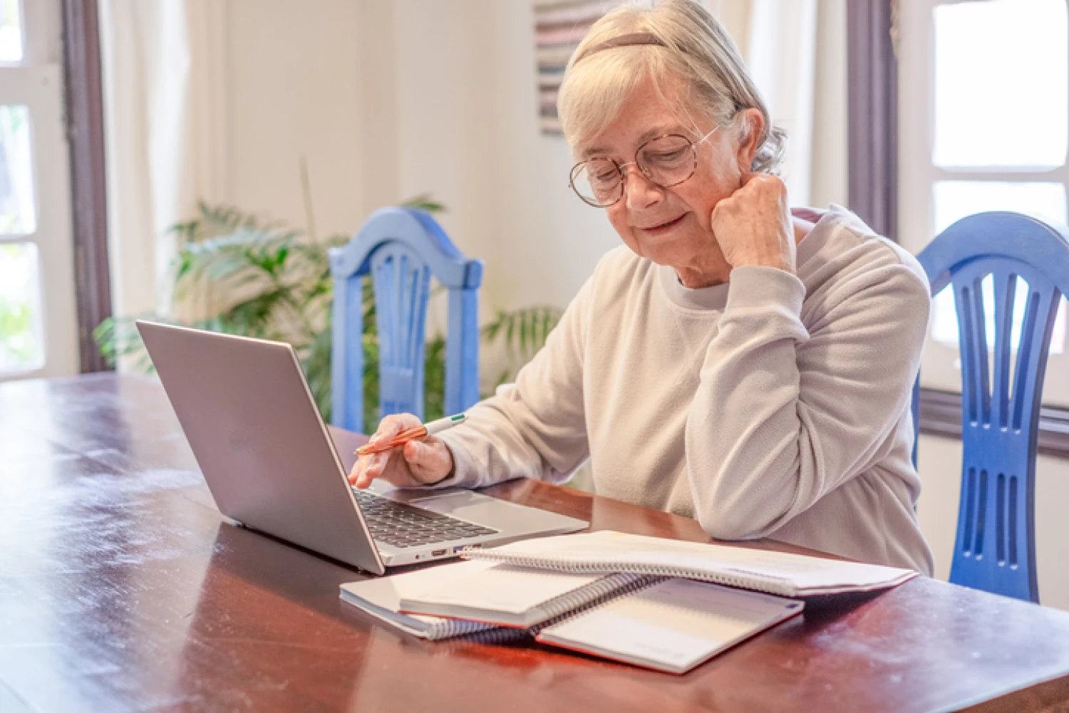 Senior woman working out budget for Level 2 Home Care Package.